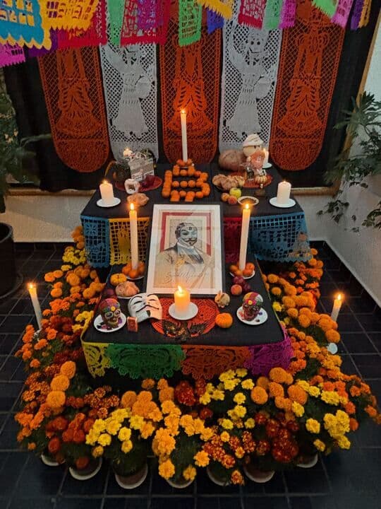 La Casa's Día de Muertos altar, marigolds and candles