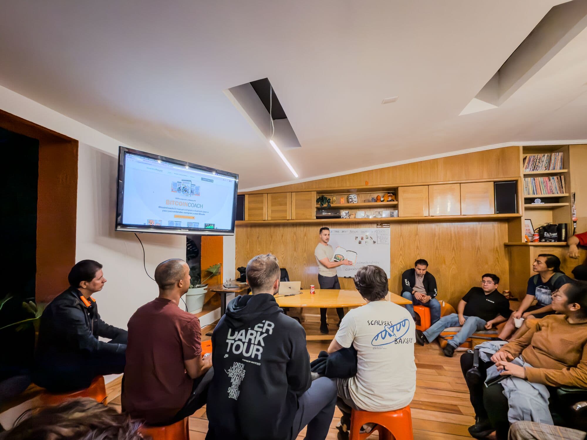 BitDevs CDMX in the wood-panelled main room, chairs in a circle