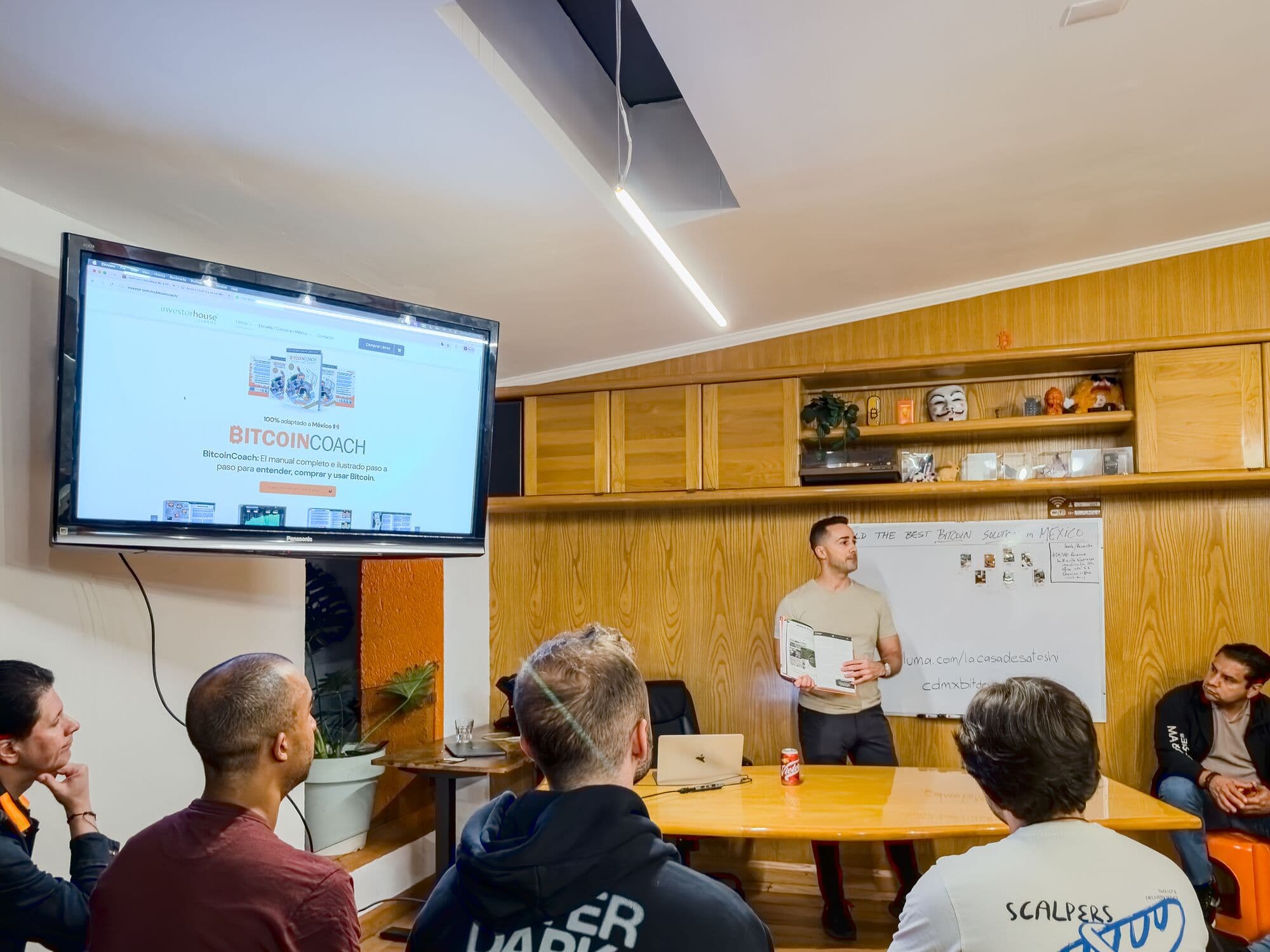 The meeting room: long table, screen, and a whiteboard